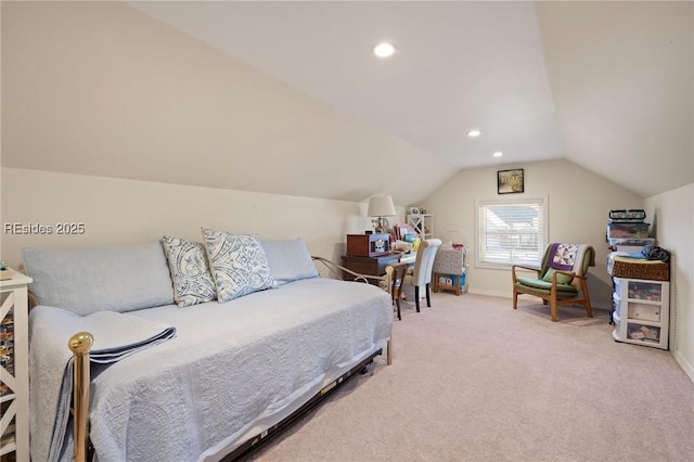 carpeted bedroom with vaulted ceiling