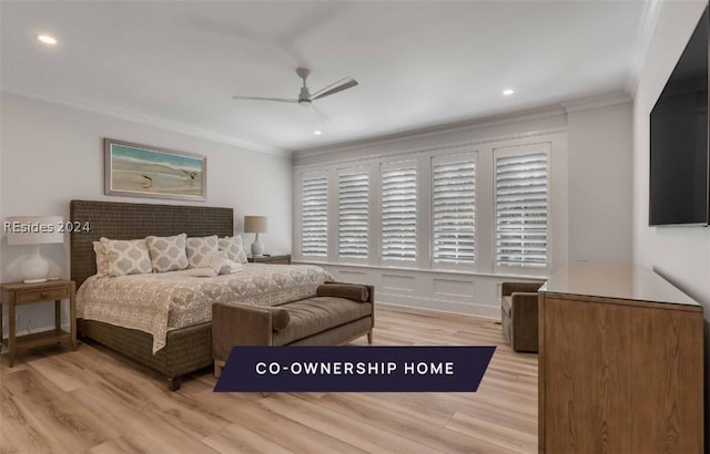 bedroom featuring ornamental molding, light hardwood / wood-style floors, and ceiling fan