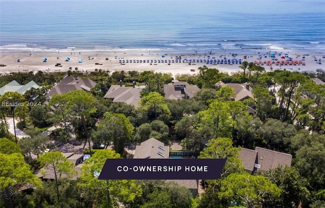 birds eye view of property featuring a view of the beach and a water view