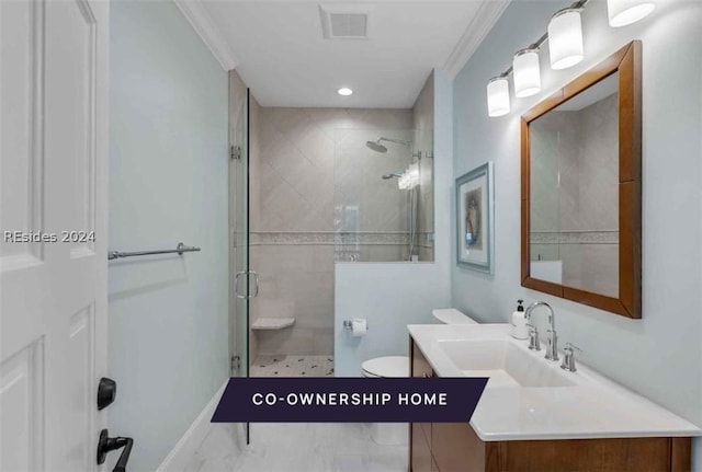 bathroom with vanity, toilet, crown molding, and walk in shower