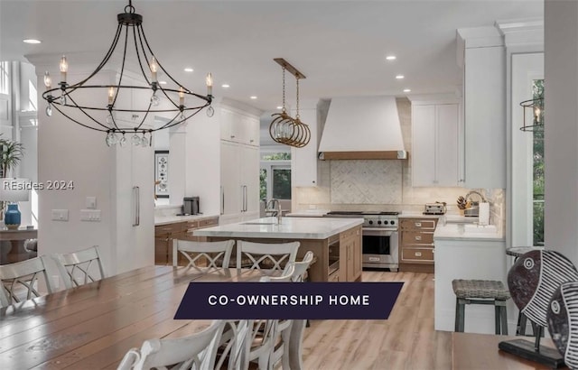 interior space featuring sink and light hardwood / wood-style flooring