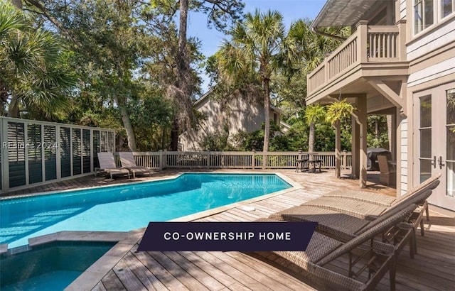 view of pool featuring a wooden deck