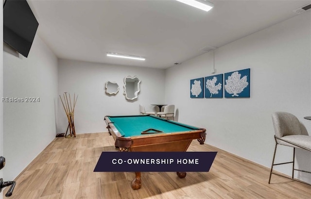 recreation room with hardwood / wood-style flooring and pool table