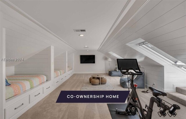 interior space featuring crown molding and vaulted ceiling