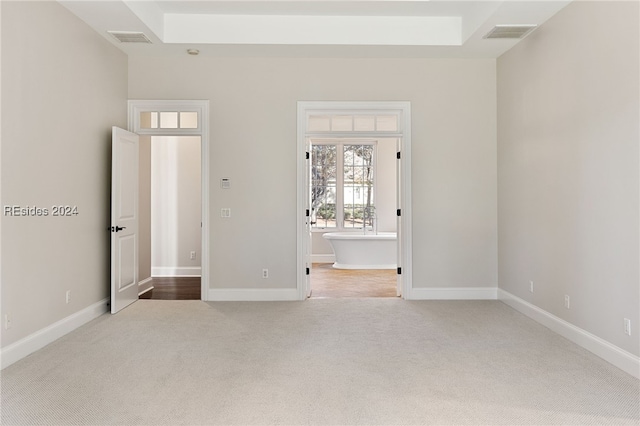 unfurnished bedroom featuring light colored carpet