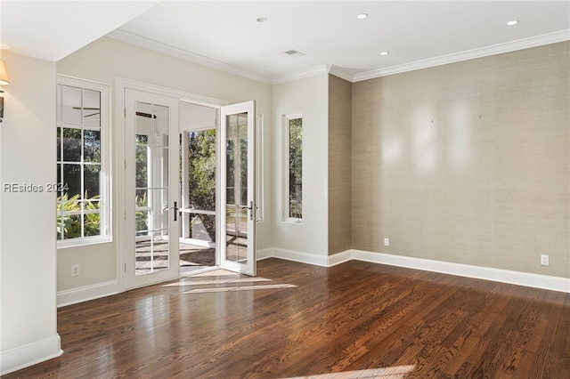 spare room with crown molding and dark hardwood / wood-style floors