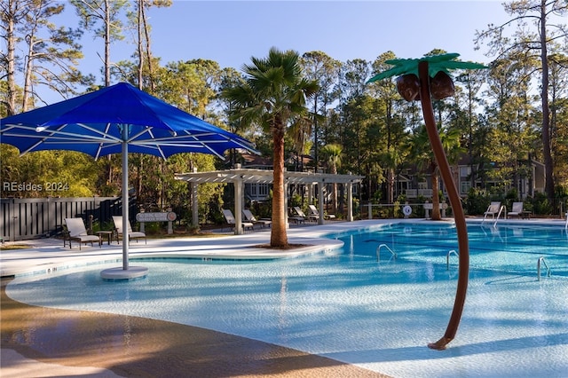 view of swimming pool with a pergola