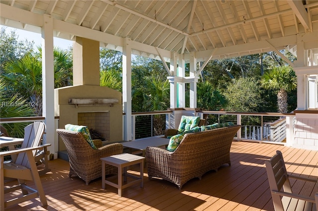 wooden deck with a gazebo and outdoor lounge area