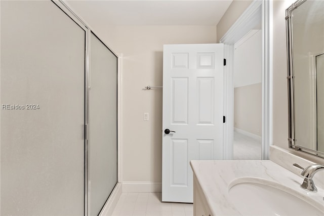 bathroom with walk in shower and vanity