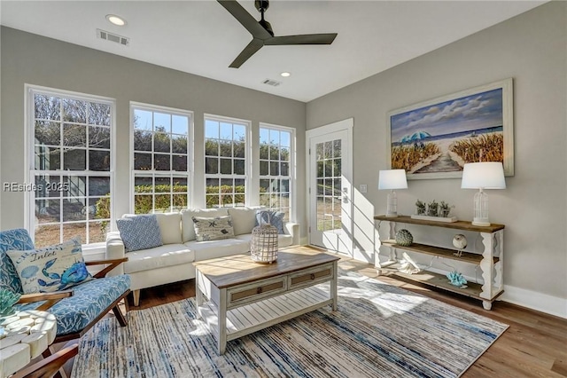 sunroom / solarium with plenty of natural light and ceiling fan