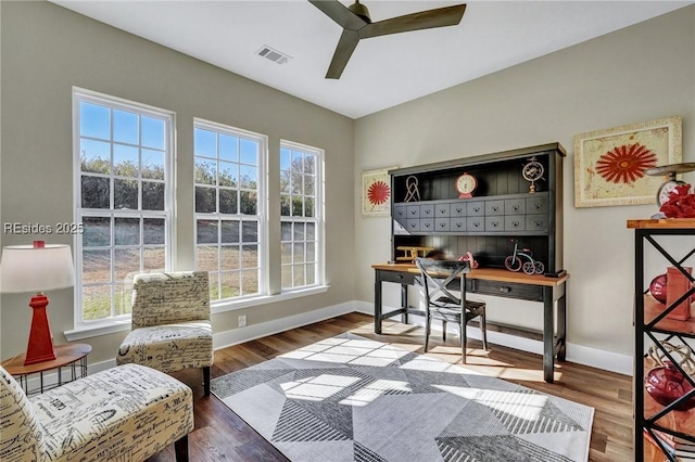 home office featuring hardwood / wood-style floors and ceiling fan