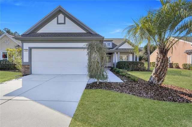 view of front facade featuring a garage and a front yard