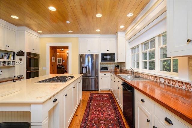 kitchen with white cabinetry, wood-type flooring, wood ceiling, and black appliances