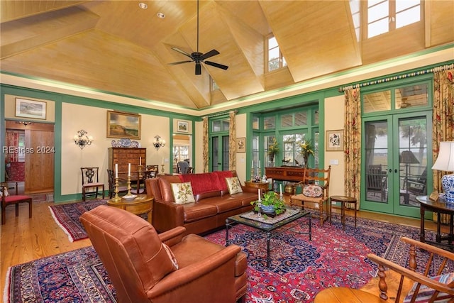 living room with hardwood / wood-style floors, high vaulted ceiling, ceiling fan, wooden ceiling, and french doors