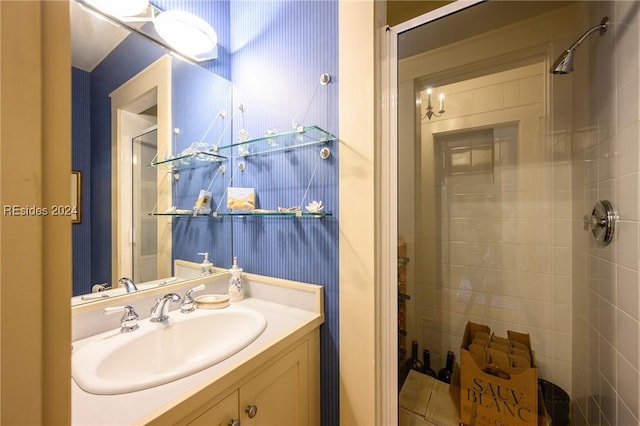 bathroom featuring walk in shower, vanity, and tile patterned flooring