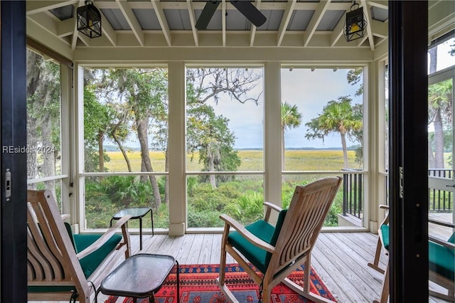 sunroom featuring a wealth of natural light and ceiling fan