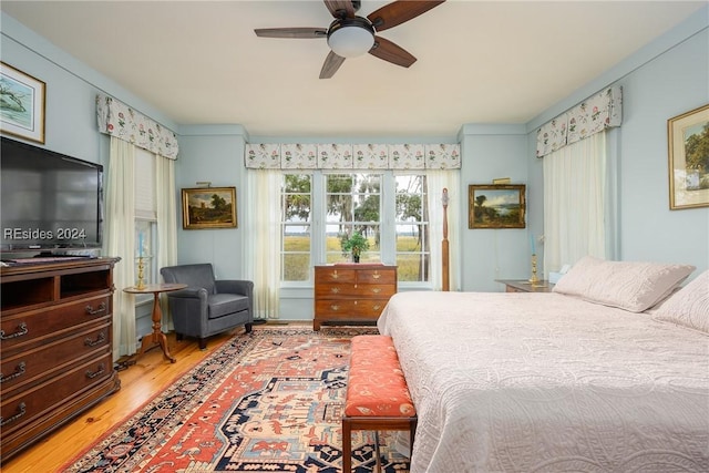 bedroom featuring hardwood / wood-style floors and ceiling fan