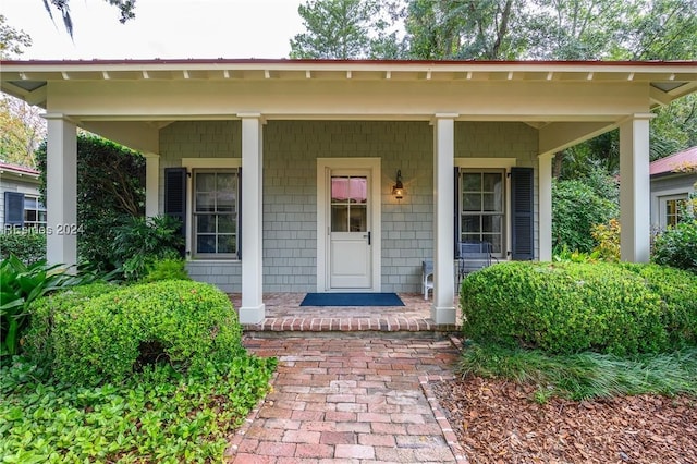 doorway to property with a porch