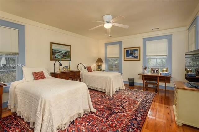 bedroom featuring ceiling fan and light hardwood / wood-style floors