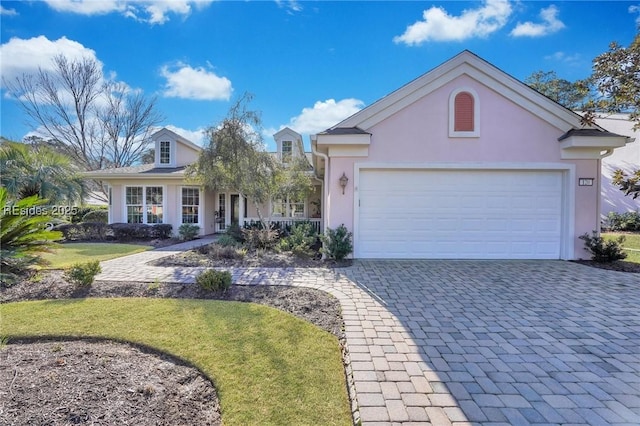 view of front of home with a garage and a front yard