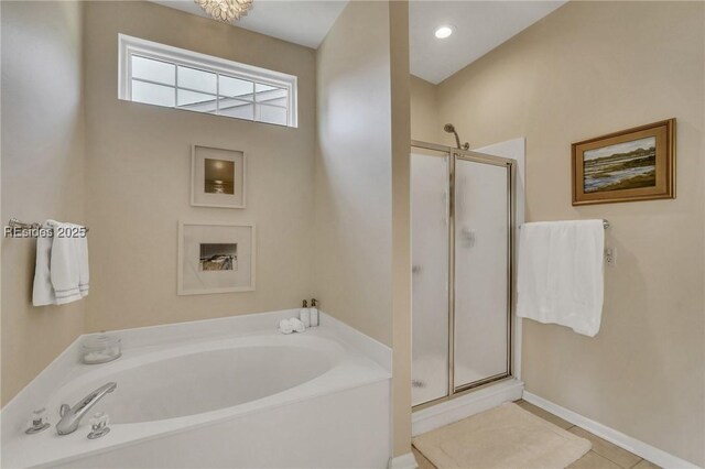 bathroom featuring tile patterned flooring and plus walk in shower