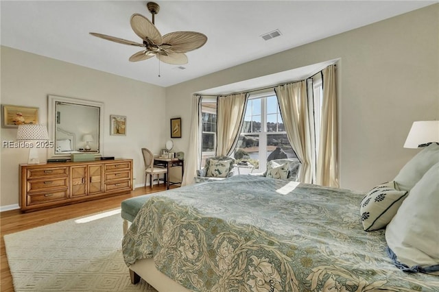 bedroom with ceiling fan and light wood-type flooring