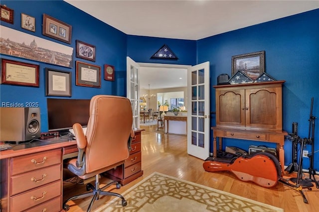 office area featuring light hardwood / wood-style floors and french doors