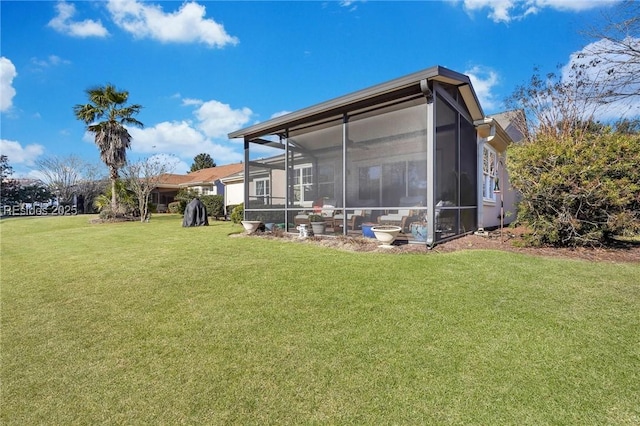 rear view of house with a lawn