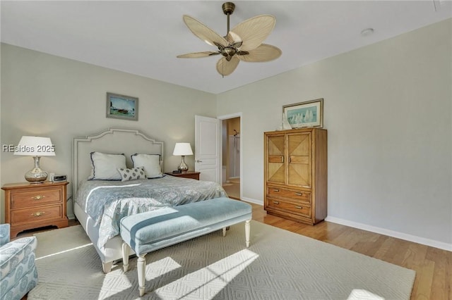 bedroom with light wood-type flooring and ceiling fan