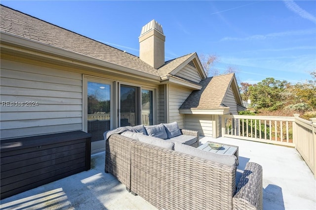 wooden deck with an outdoor living space