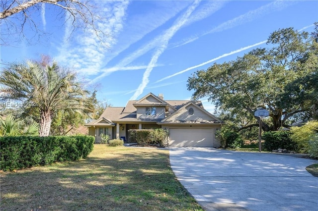 view of front of home featuring a garage and a front yard