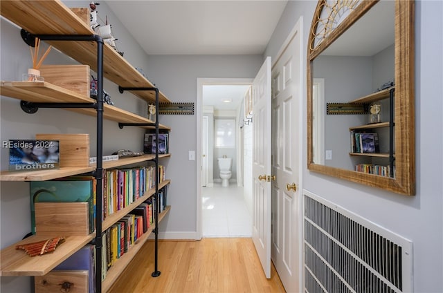 corridor featuring light hardwood / wood-style flooring