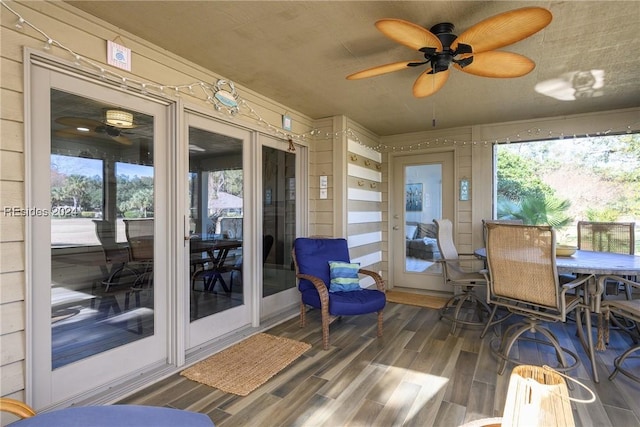 sunroom / solarium with french doors and ceiling fan