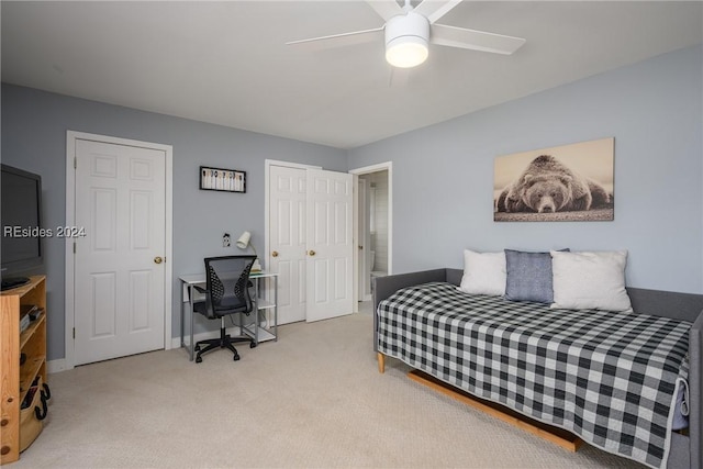 bedroom featuring light carpet and ceiling fan