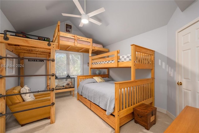 carpeted bedroom with vaulted ceiling and ceiling fan