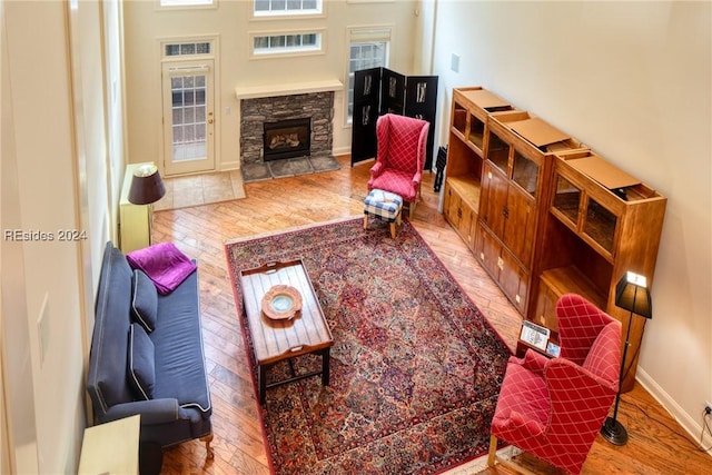 living room with a fireplace and light hardwood / wood-style flooring