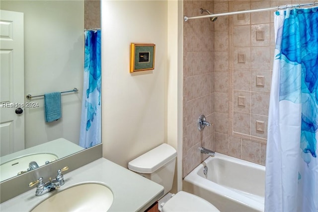 full bathroom with vanity, shower / bath combination with curtain, and toilet