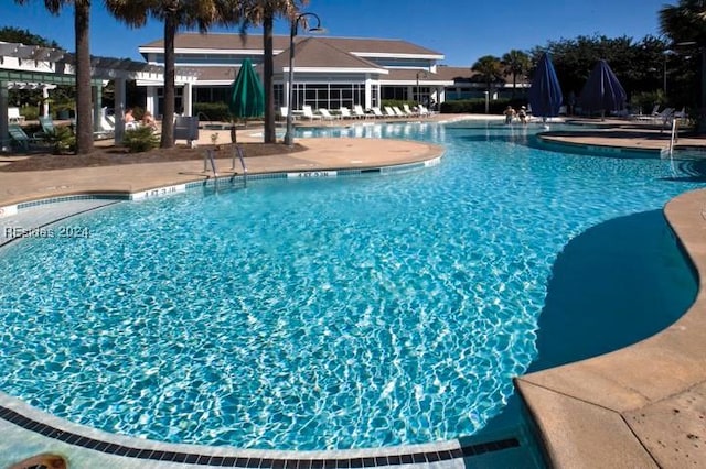 view of swimming pool featuring a patio area