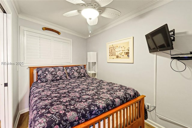 bedroom with ornamental molding and ceiling fan