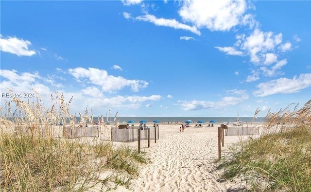 view of water feature with a beach view