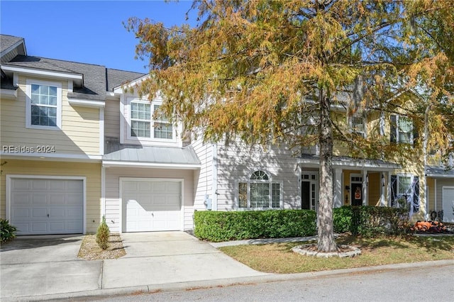 multi unit property featuring a garage