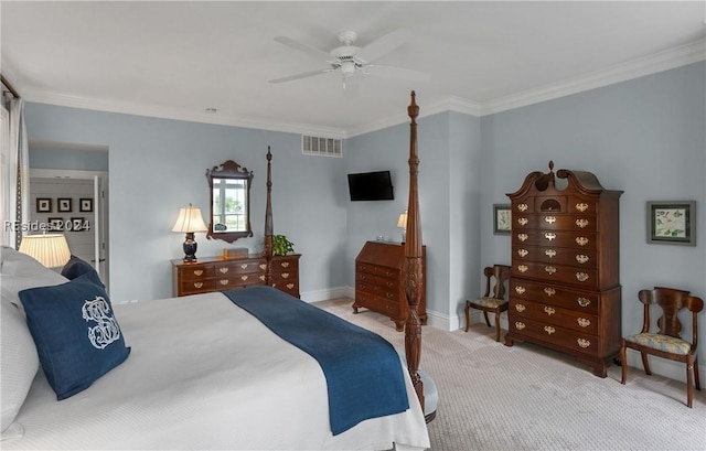 bedroom featuring ceiling fan, ornamental molding, and light colored carpet