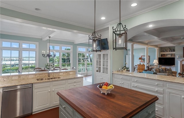 kitchen with white cabinets, dishwasher, wooden counters, and beam ceiling