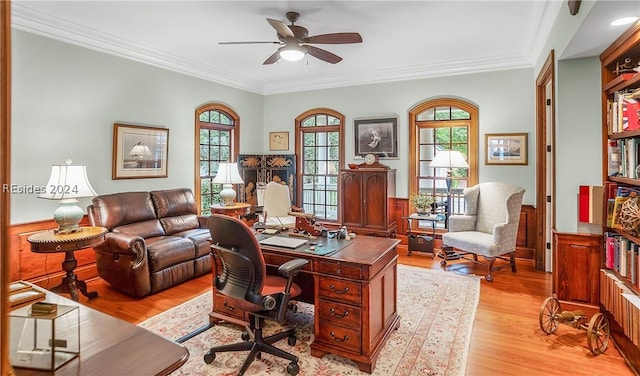 office space with crown molding, light hardwood / wood-style floors, and ceiling fan