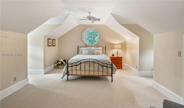 bedroom with ceiling fan, vaulted ceiling, and light carpet