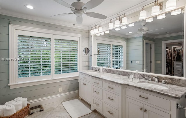 bathroom featuring vanity, crown molding, tile patterned floors, and ceiling fan