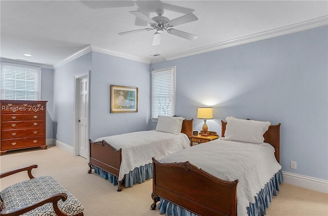 carpeted bedroom featuring ornamental molding and ceiling fan