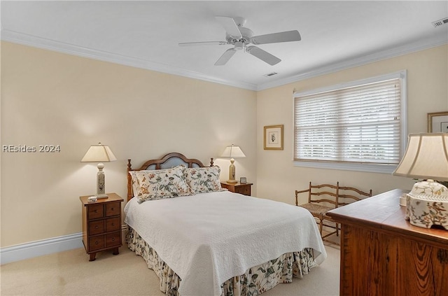 bedroom with crown molding, light colored carpet, and ceiling fan