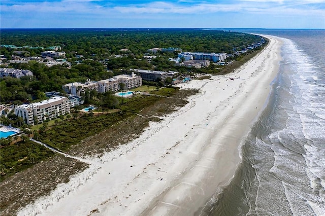 drone / aerial view featuring a water view and a beach view