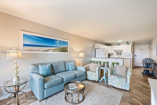 living room with crown molding and light parquet flooring